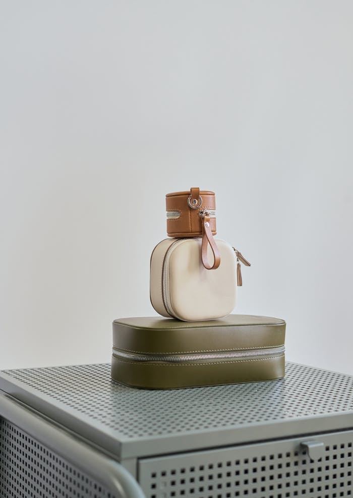 services-01 Assorted small handbags on a metal cabinet with a sleek, minimalist style.
